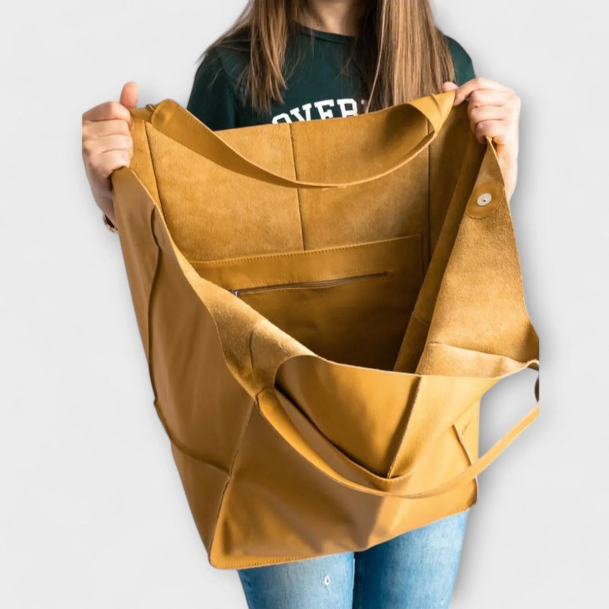Women's spacious faux leather tote bag with two exterior slip pockets