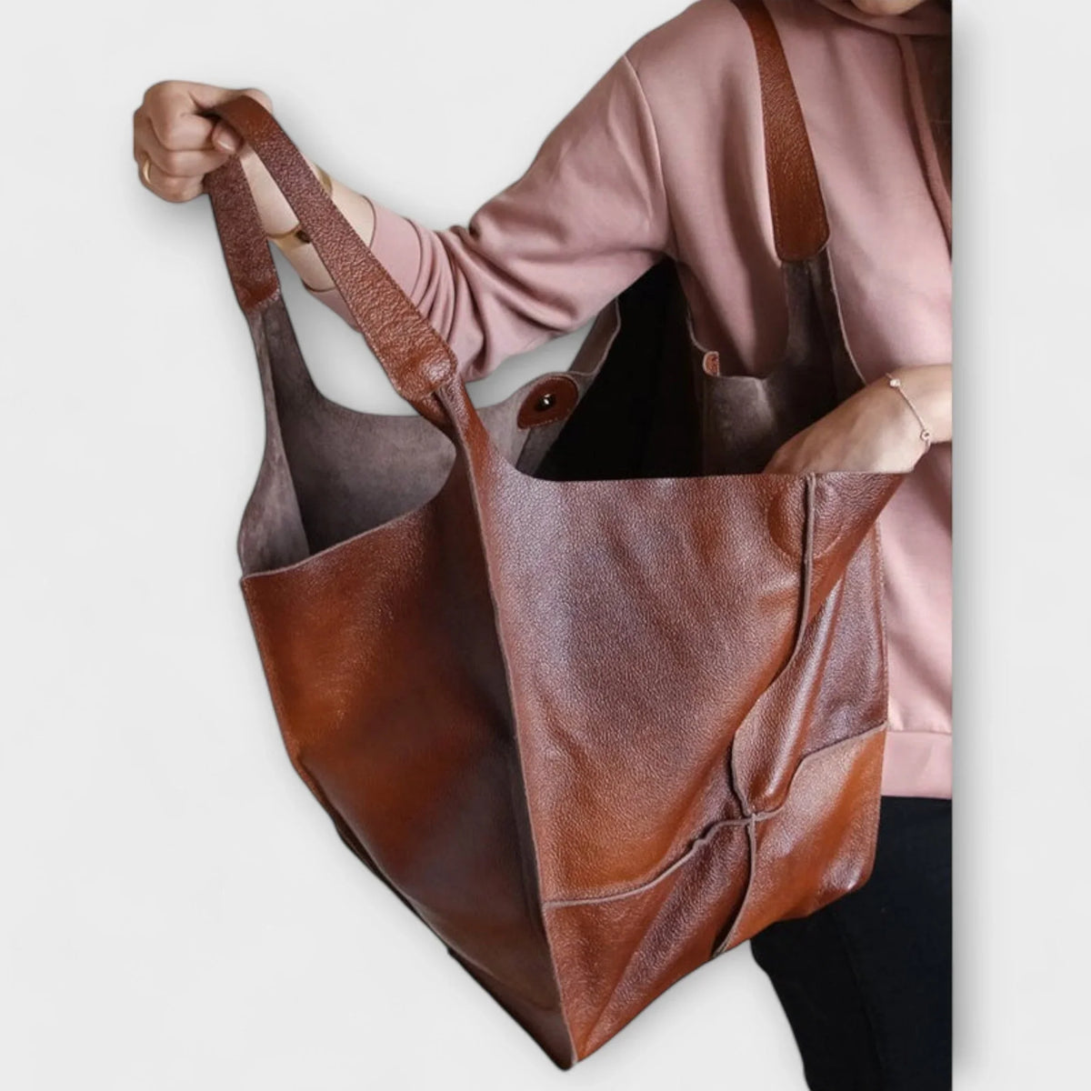 Women's spacious faux leather tote bag with two exterior slip pockets