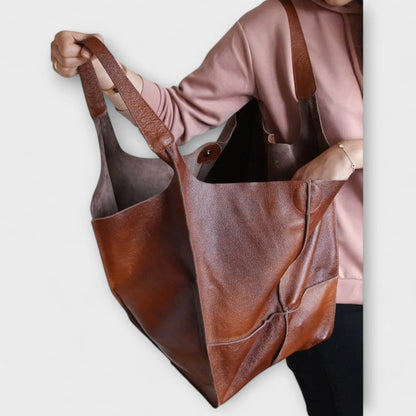 Women's spacious faux leather tote bag with two exterior slip pockets