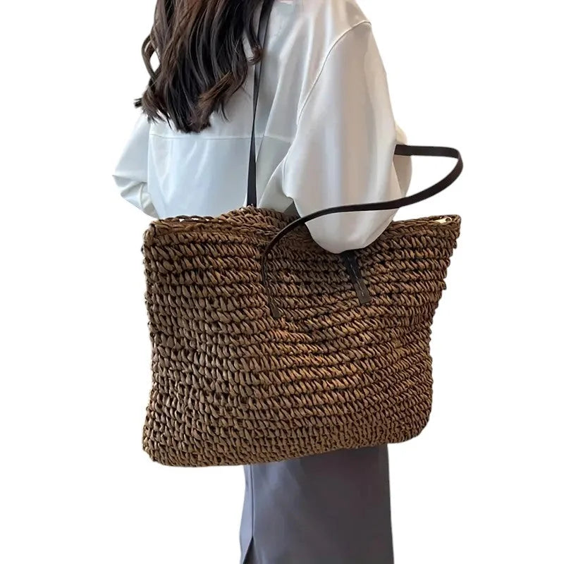 Women's spacious woven straw tote bag with double faux-leather straps