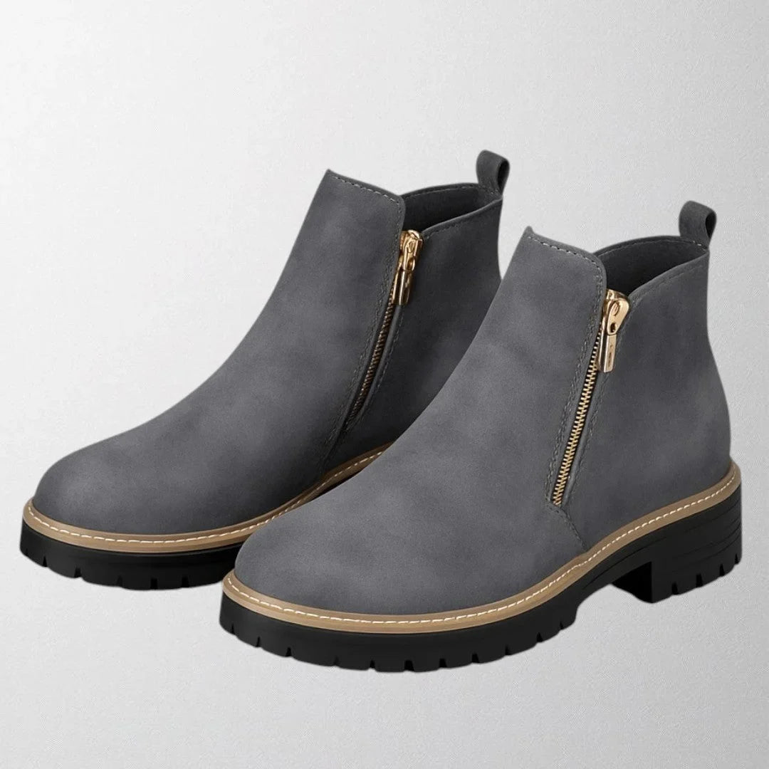 Women's suede chunky-sole ankle boot with round toe and tone side zip