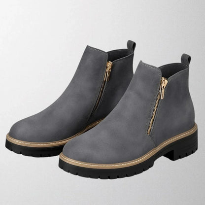 Women's suede chunky-sole ankle boot with round toe and tone side zip
