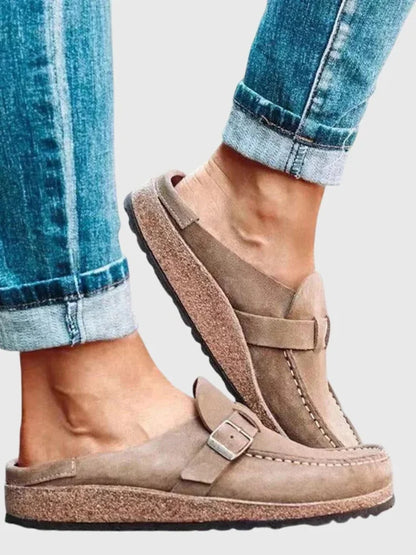 Women's suede comfort clogs with buckled strap and contrast stitching