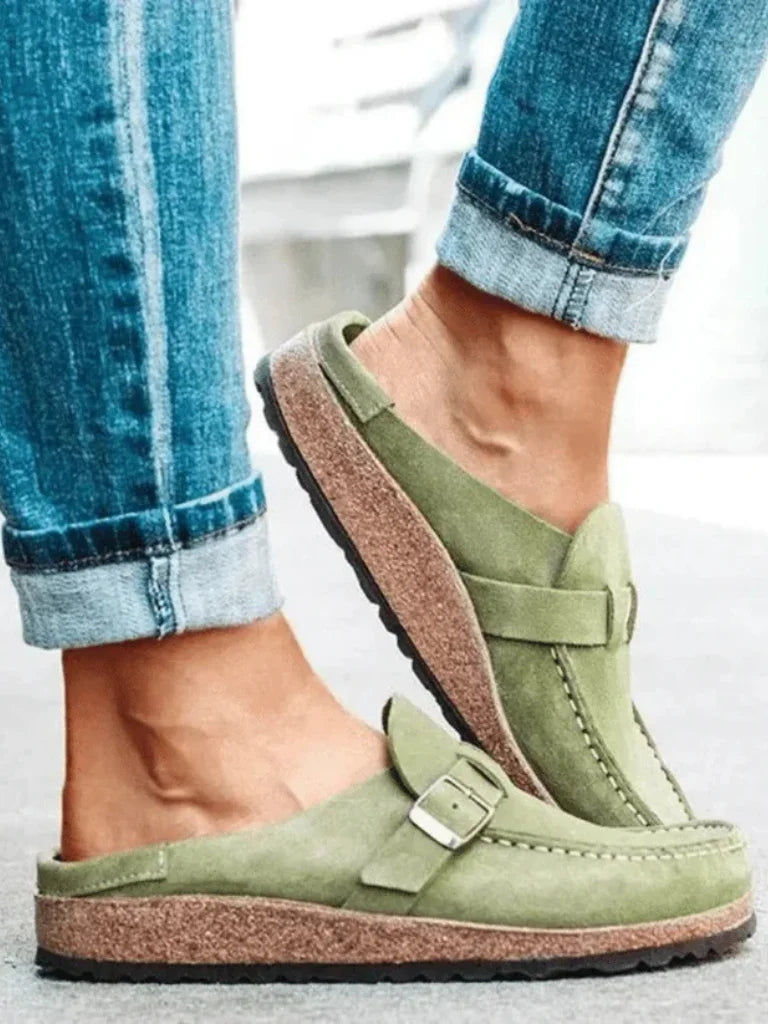 Women's suede comfort clogs with buckled strap and contrast stitching