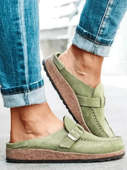 Women's suede comfort clogs with buckled strap and contrast stitching
