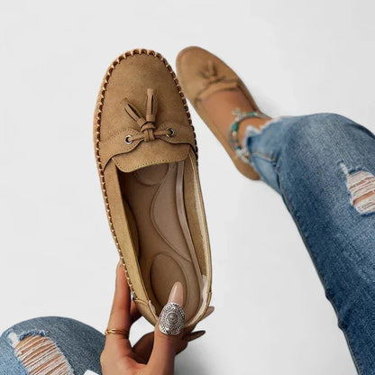 Women's suede slip-on moccasin flat loafers with tasseled bow detail