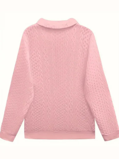 Women's textured knit sweater with quarter-zip closure and long sleeves