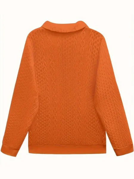 Women's textured knit sweater with quarter-zip closure and long sleeves