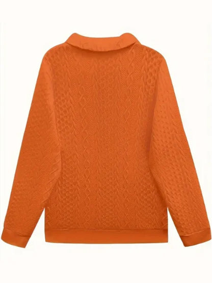 Women's textured knit sweater with quarter-zip closure and long sleeves
