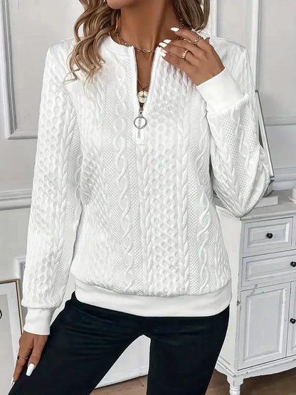 Women's textured knit sweater with quarter-zip closure and long sleeves