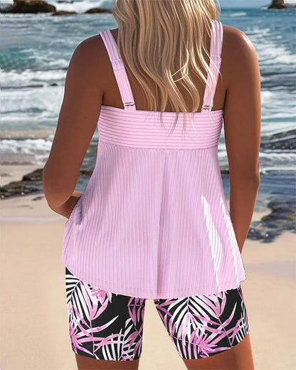 Women's tummy-control ribbed tankini with twist-front and tropical print shorts