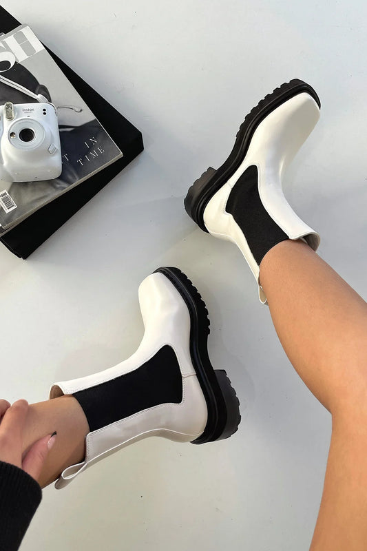 Women's two-tone ankle boots with elastic sides and chunky lug sole – White