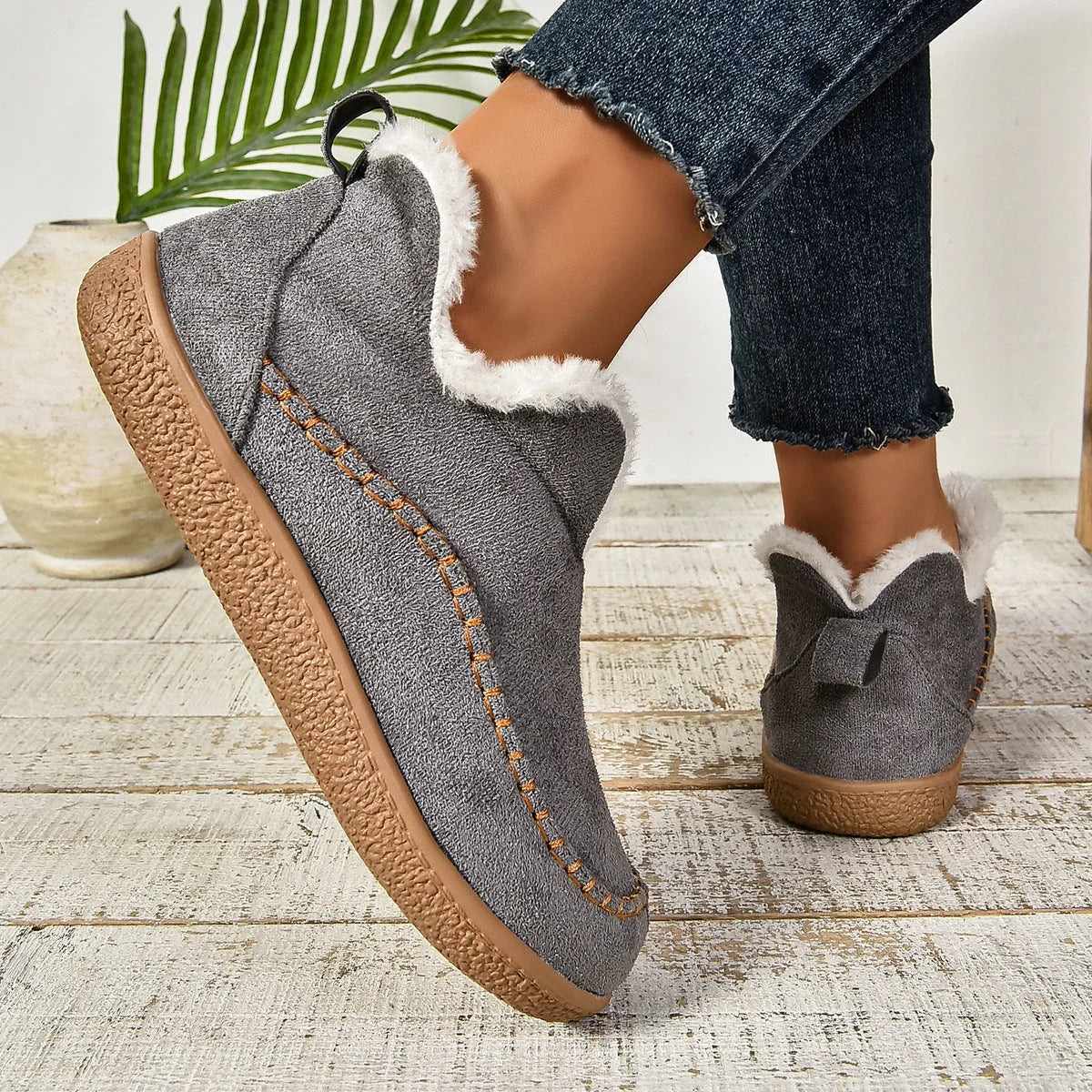 Women's warm fur-lined slip-on ankle boots with thick sole and moc-toe stitching