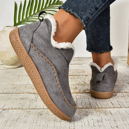 Women's warm fur-lined slip-on ankle boots with thick sole and moc-toe stitching