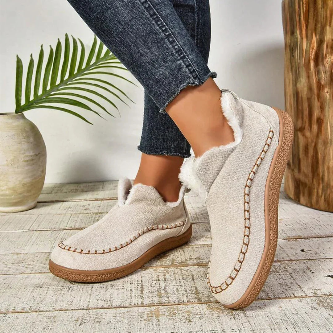 Women's warm fur-lined slip-on ankle boots with thick sole and moc-toe stitching