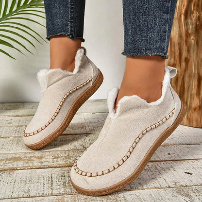 Women's warm fur-lined slip-on ankle boots with thick sole and moc-toe stitching