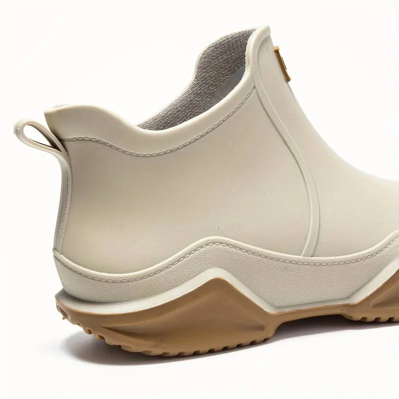 Women's waterproof comfort boots with pull-on tab and contrast sole