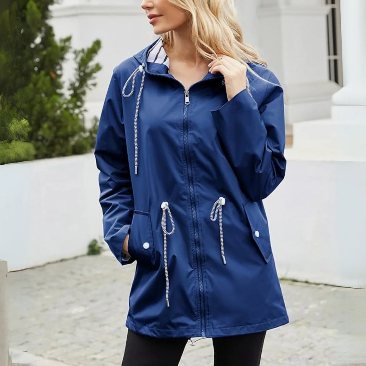 Women's waterproof hooded jacket with striped lining and drawstring waist