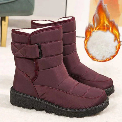 Women's waterproof quilted mid-calf winter boots with velcro strap closure
