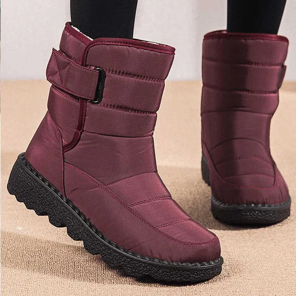 Women's waterproof quilted mid-calf winter boots with velcro strap closure