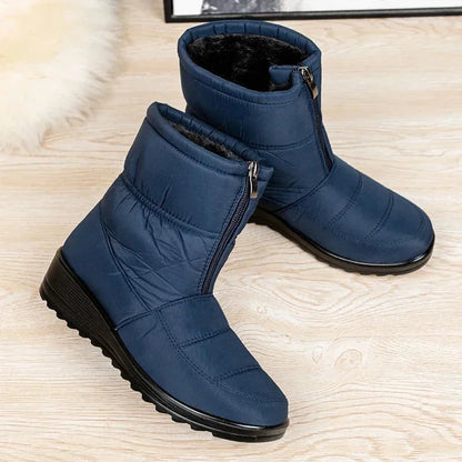 Women's waterproof quilted mid-calf winter boots with velcro strap closure