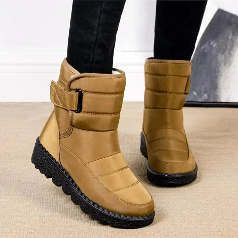 Women's waterproof quilted mid-calf winter boots with velcro strap closure