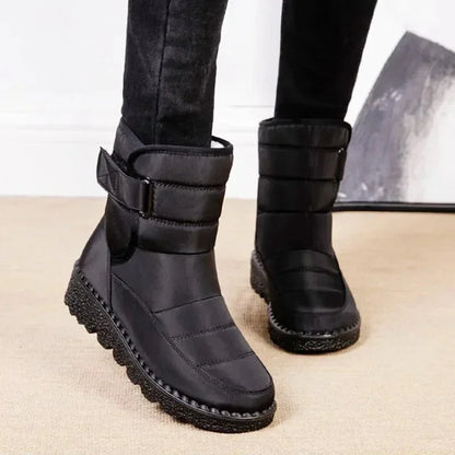 Women's waterproof quilted mid-calf winter boots with velcro strap closure
