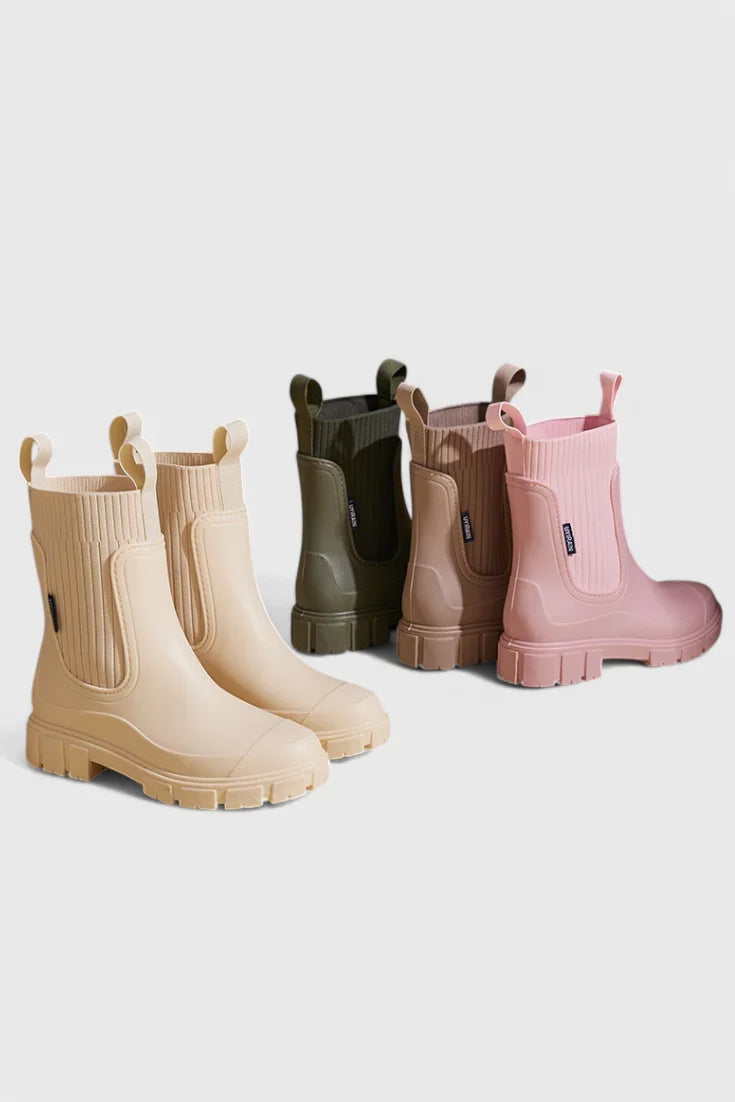 Women's waterproof rubber chelsea boots with ribbed knit cuffs and lug sole