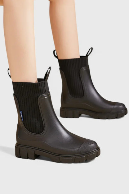 Women's waterproof rubber chelsea boots with ribbed knit cuffs and lug sole