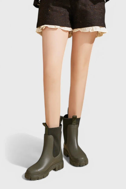 Women's waterproof rubber chelsea boots with ribbed knit cuffs and lug sole