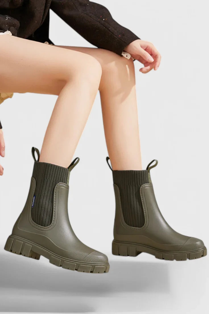 Women's waterproof rubber chelsea boots with ribbed knit cuffs and lug sole