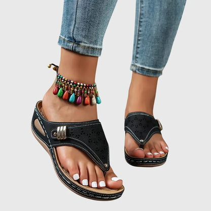Women's wedge toe-loop slip-on sandals with quilted footbed and laser-cut detail