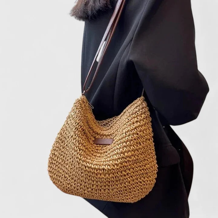 Women's woven straw hobo shoulder bag with adjustable faux-leather strap
